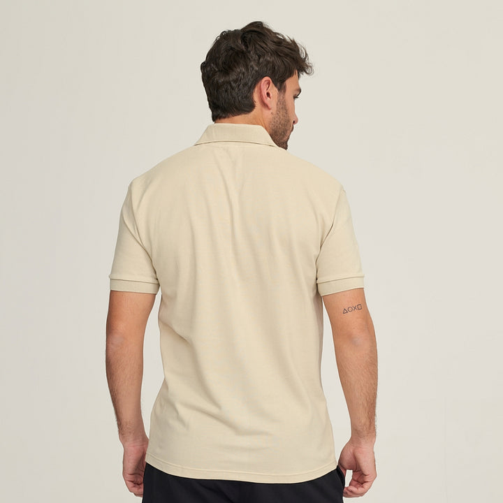 7290 POLO PIQUÉ CON PUÑO Y BOLSILLO. CORTE HOLGADO